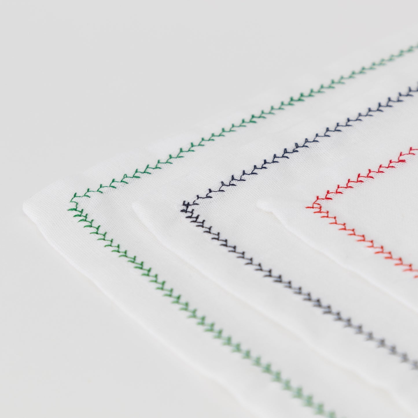 white cotton napkins with decorative trim