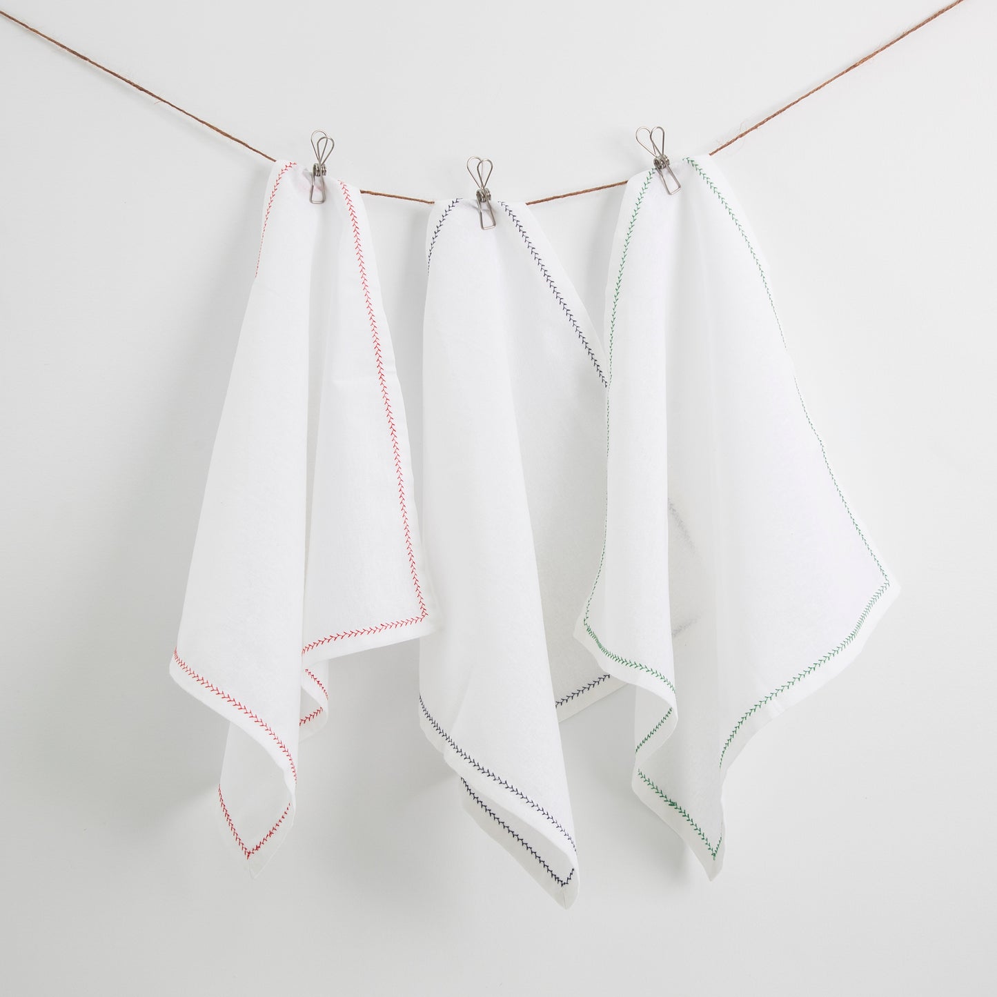 white cotton napkins with decorative trim