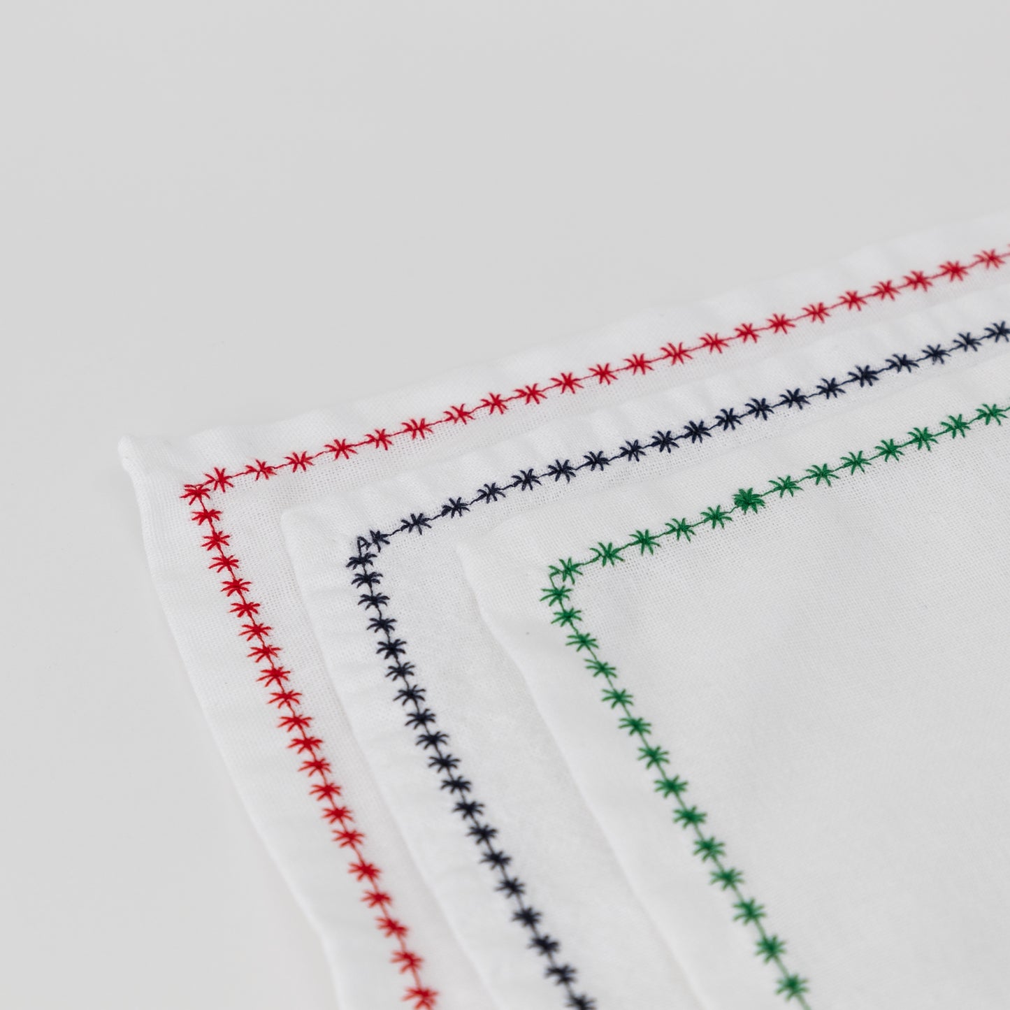 white cotton napkins with decorative trim