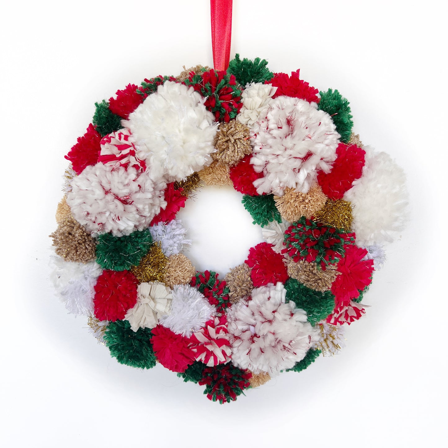 Red, Green, White Pom Pom Christmas Wreath. Handmade using a variety of yarns.