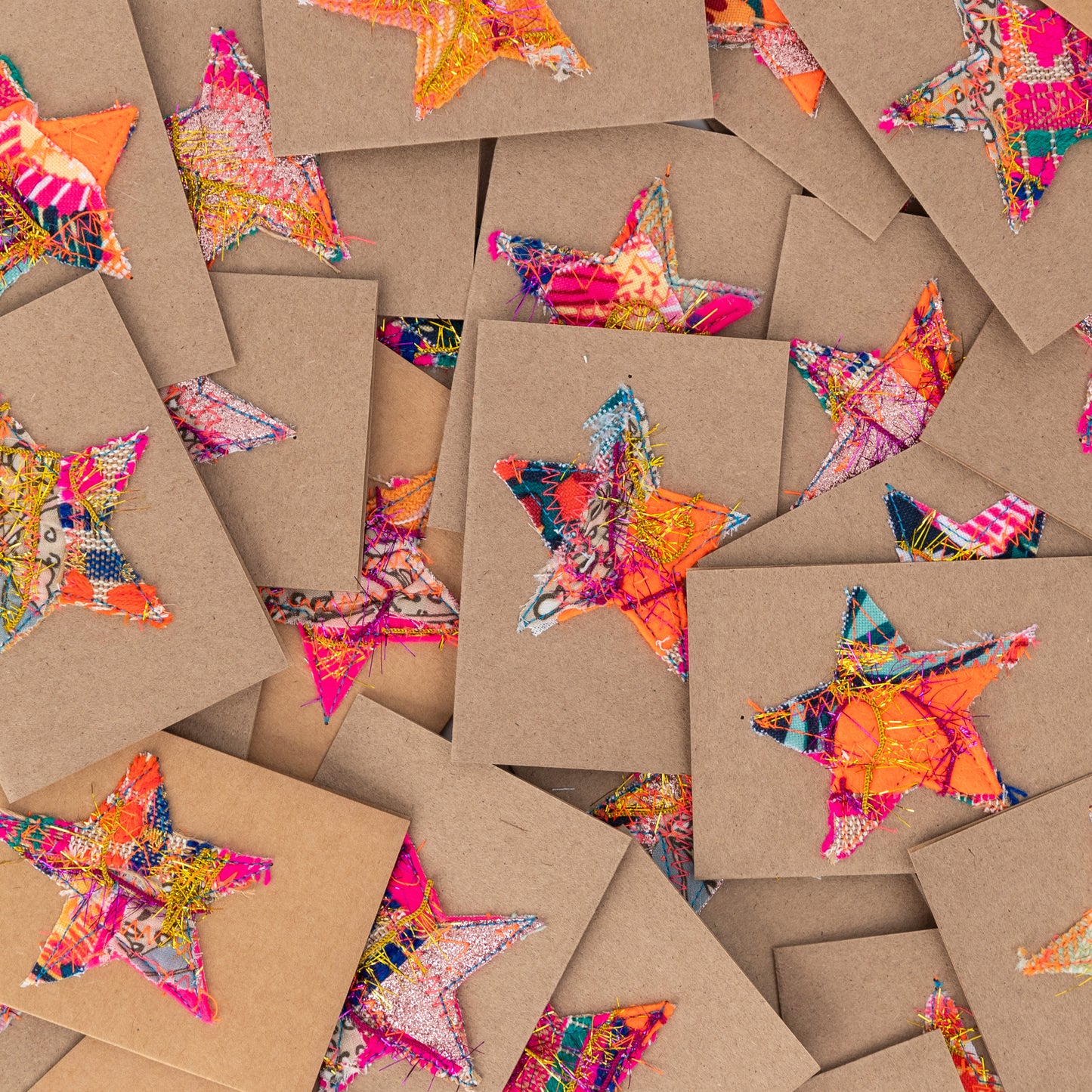 fabric stars sewn onto brown gift cards. no two the same!