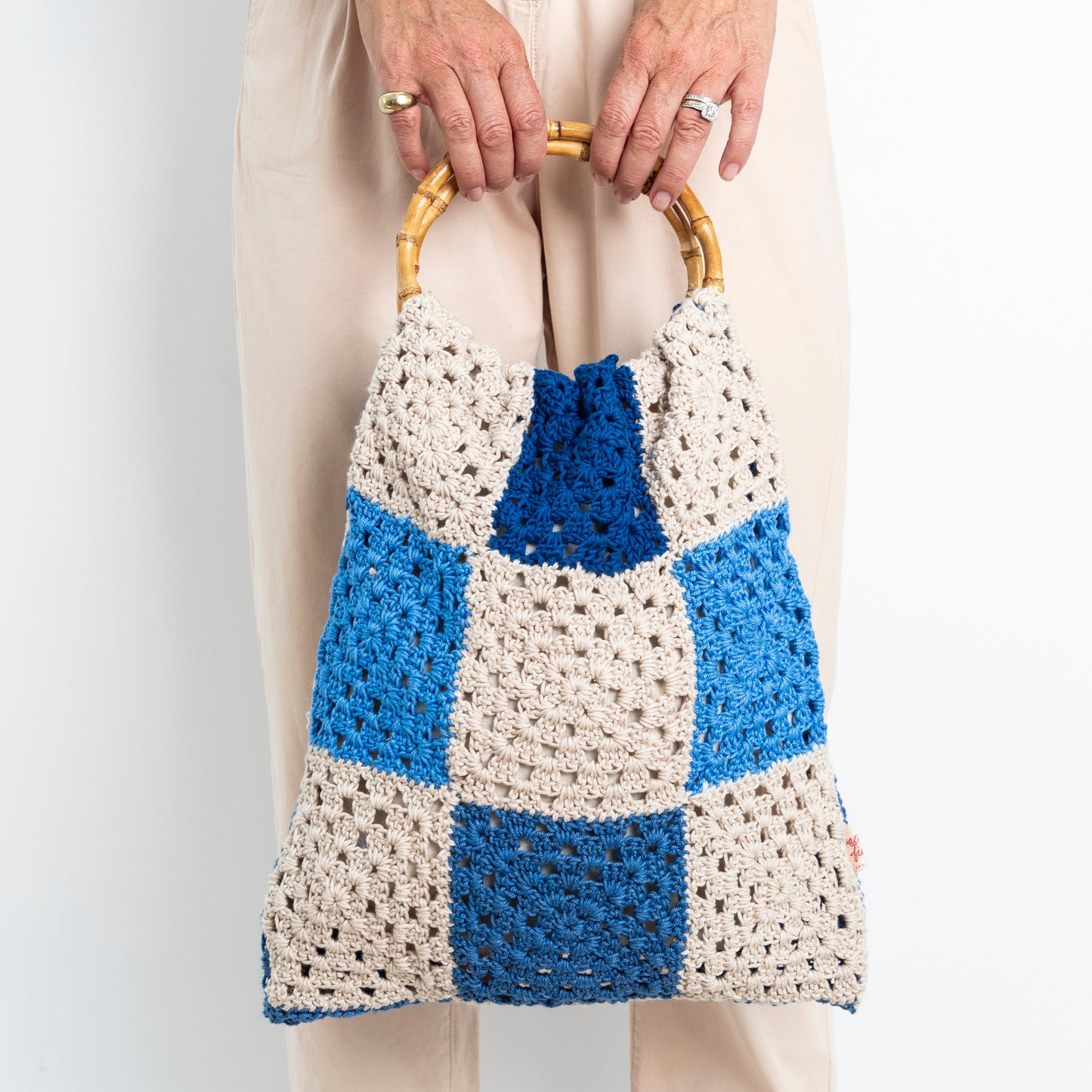 Repurposed, Crochet Blanket made into a bag with bamboo handles.