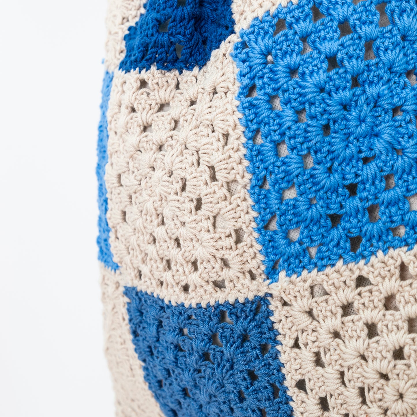 close up detail of Repurposed, Crochet Blanket made into a bag with bamboo handles.