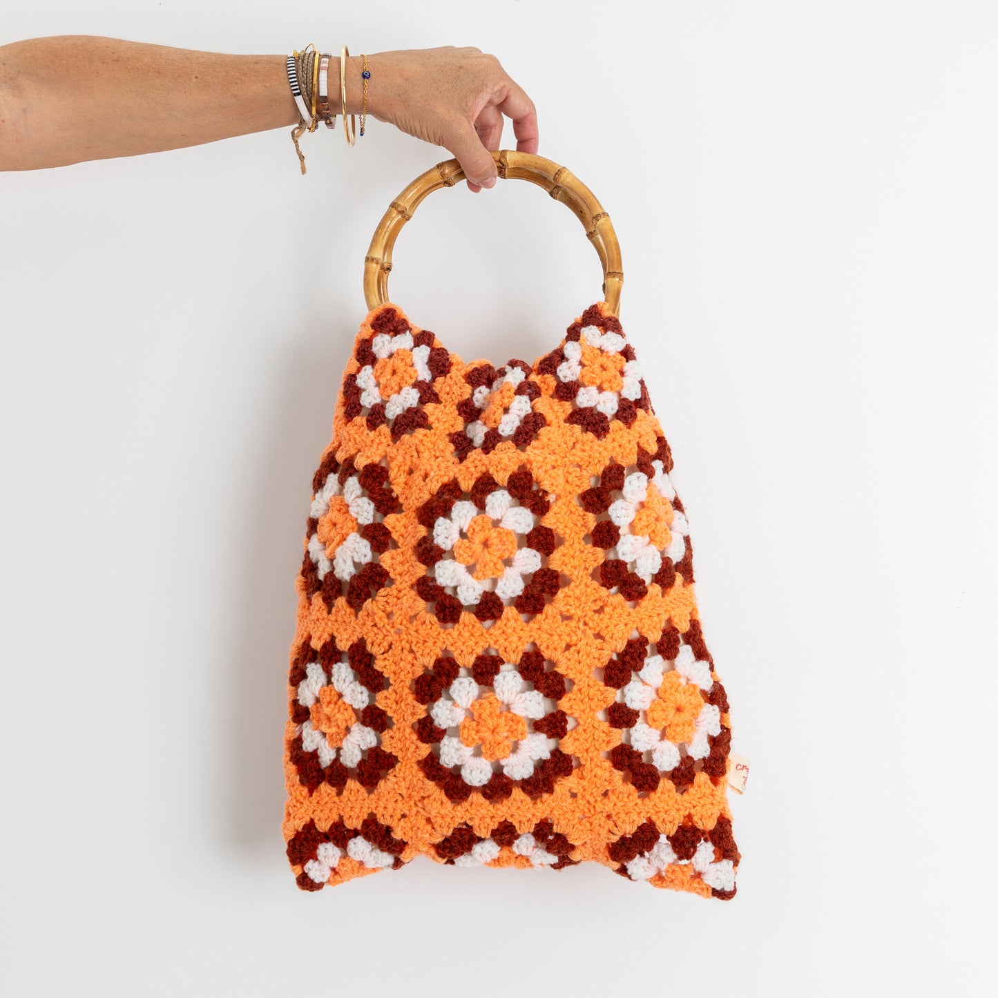Repurposed, Crochet Blanket made into a bag with bamboo handles.