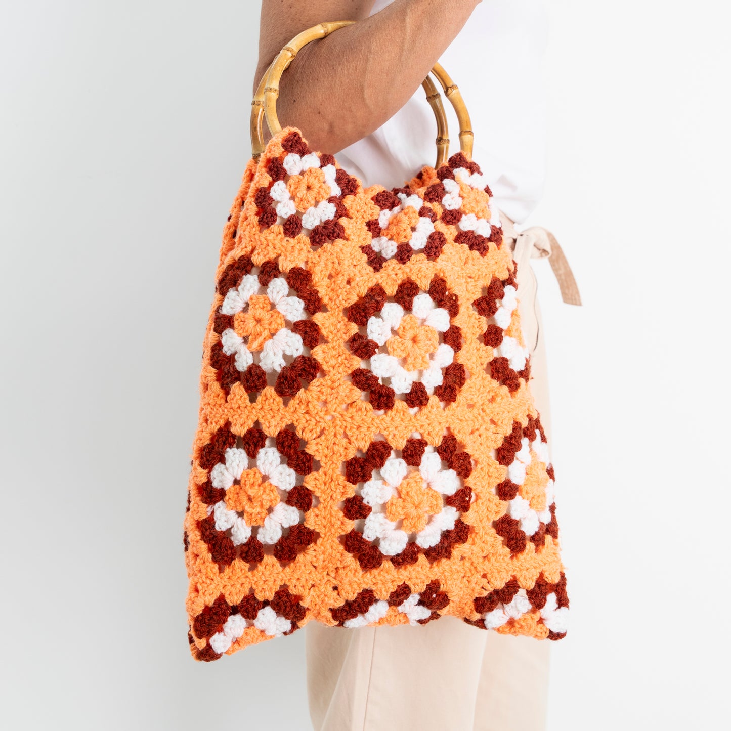 Repurposed, Crochet Blanket made into a bag with bamboo handles.