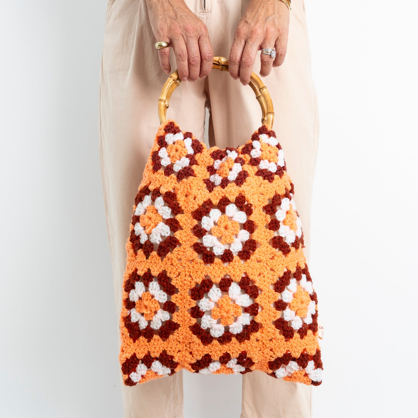 Repurposed, Crochet Blanket made into a bag with bamboo handles.