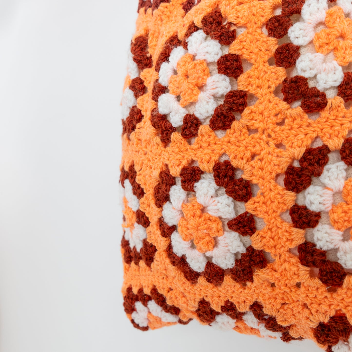 close up detail of Repurposed, Crochet Blanket made into a bag with bamboo handles.