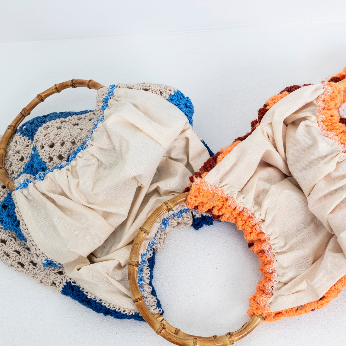 Interior lining of both repurposed, Crochet Blanket Bags, with bamboo handles.