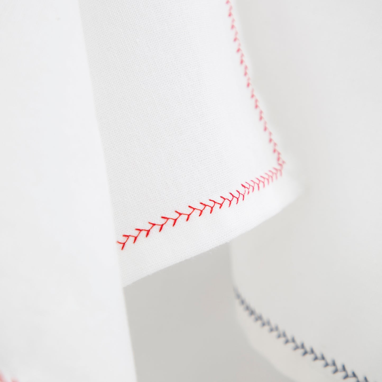 white cotton napkins with decorative trim