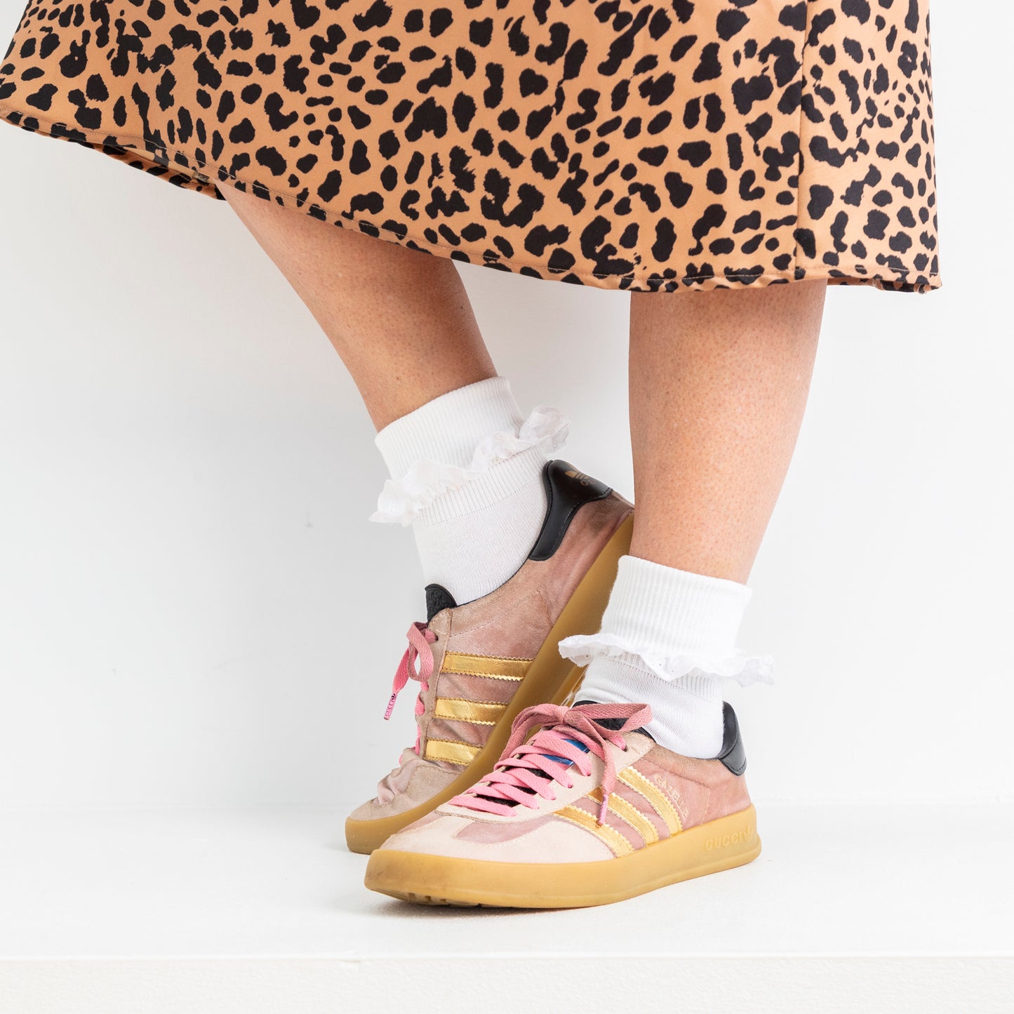 lace trim white ankle socks worn here, folded over with sneakers