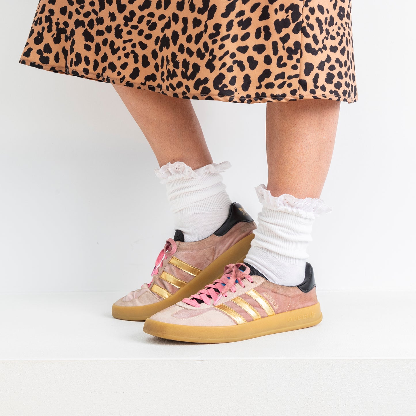 lace trim white ankle socks worn here, bunched up with sneakers