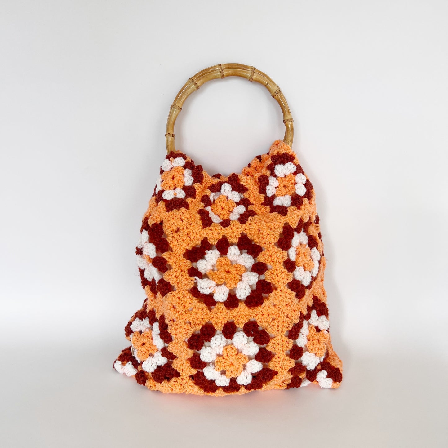 orange, brown & white crochet bag with bamboo handles