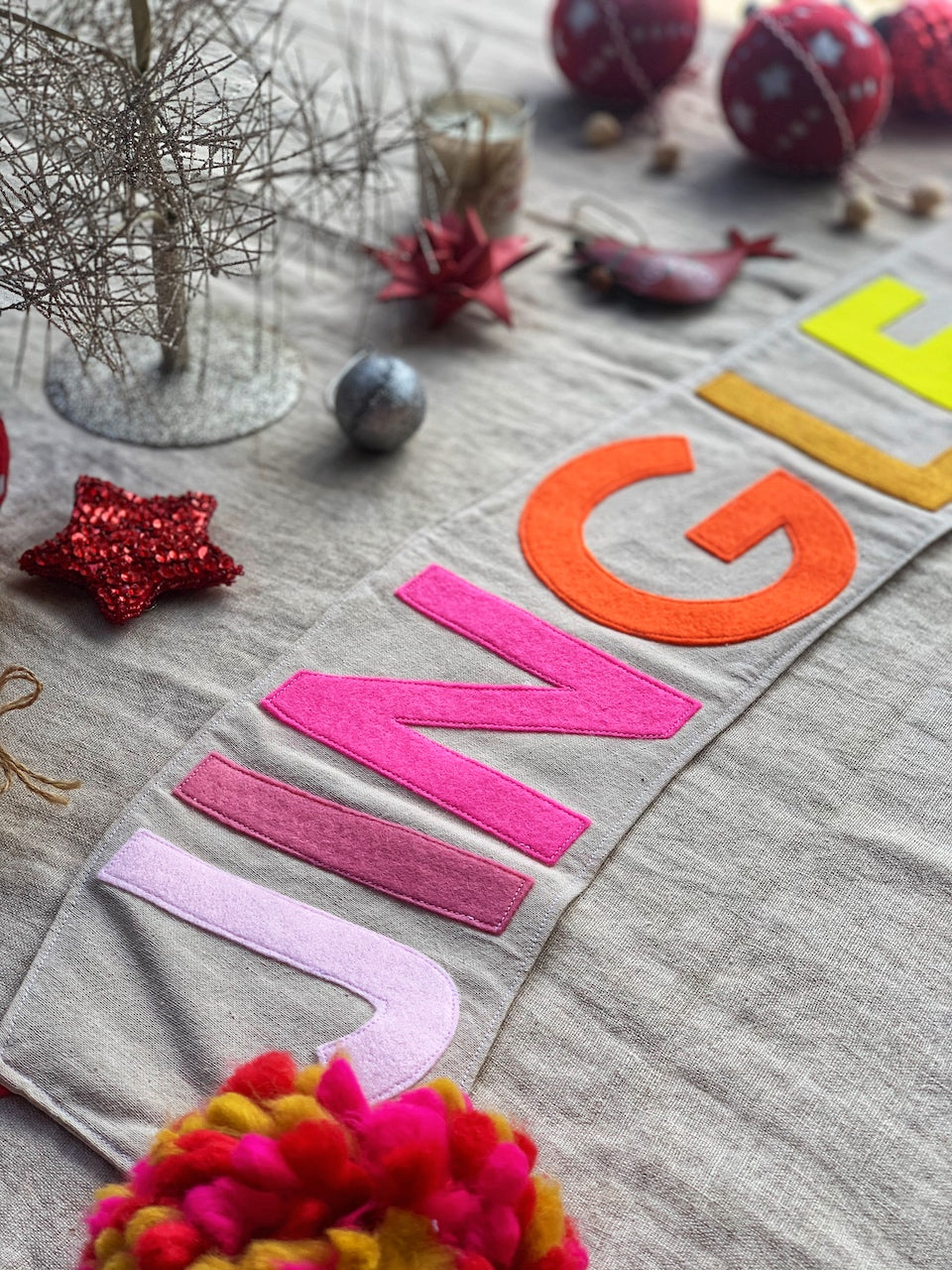 Jingle All the Way Banner lying on table