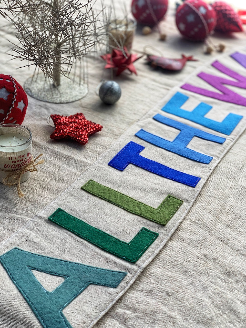 Jingle All the Way Banner up close lying on table