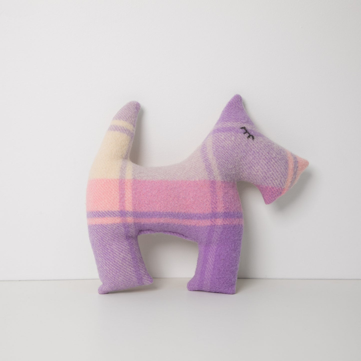 Purple Blanket upcycled to make this Scotty Dog, standing on white background