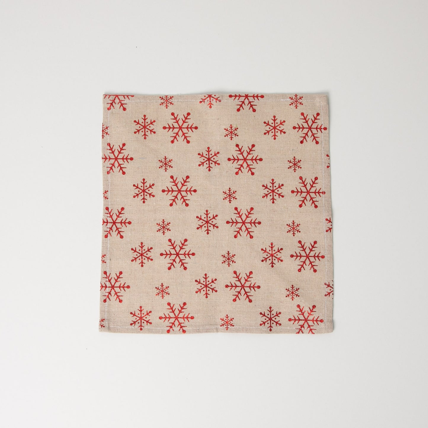 1 x square snowflake napkin sitting flat on white background
