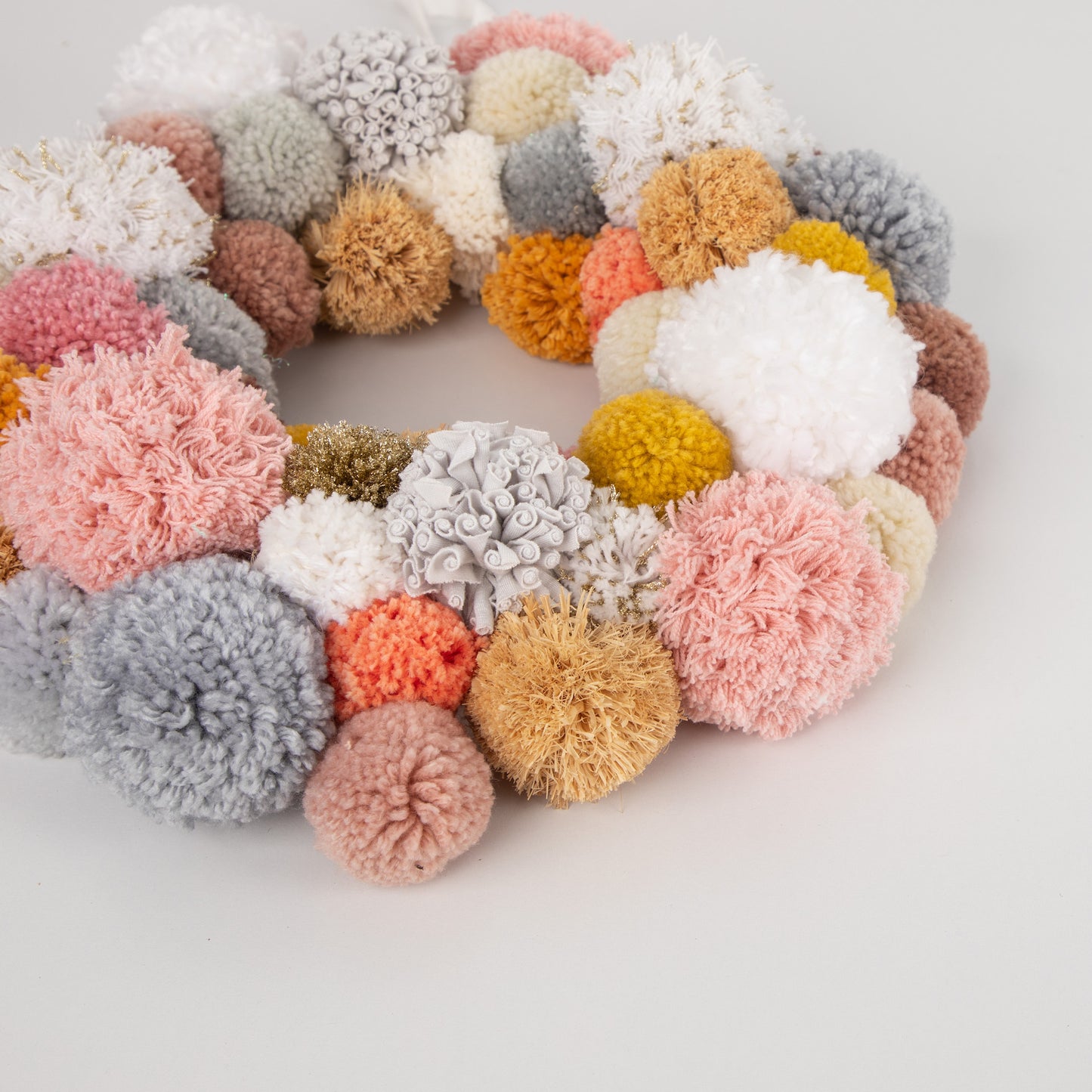 close up of pink pompom wreath