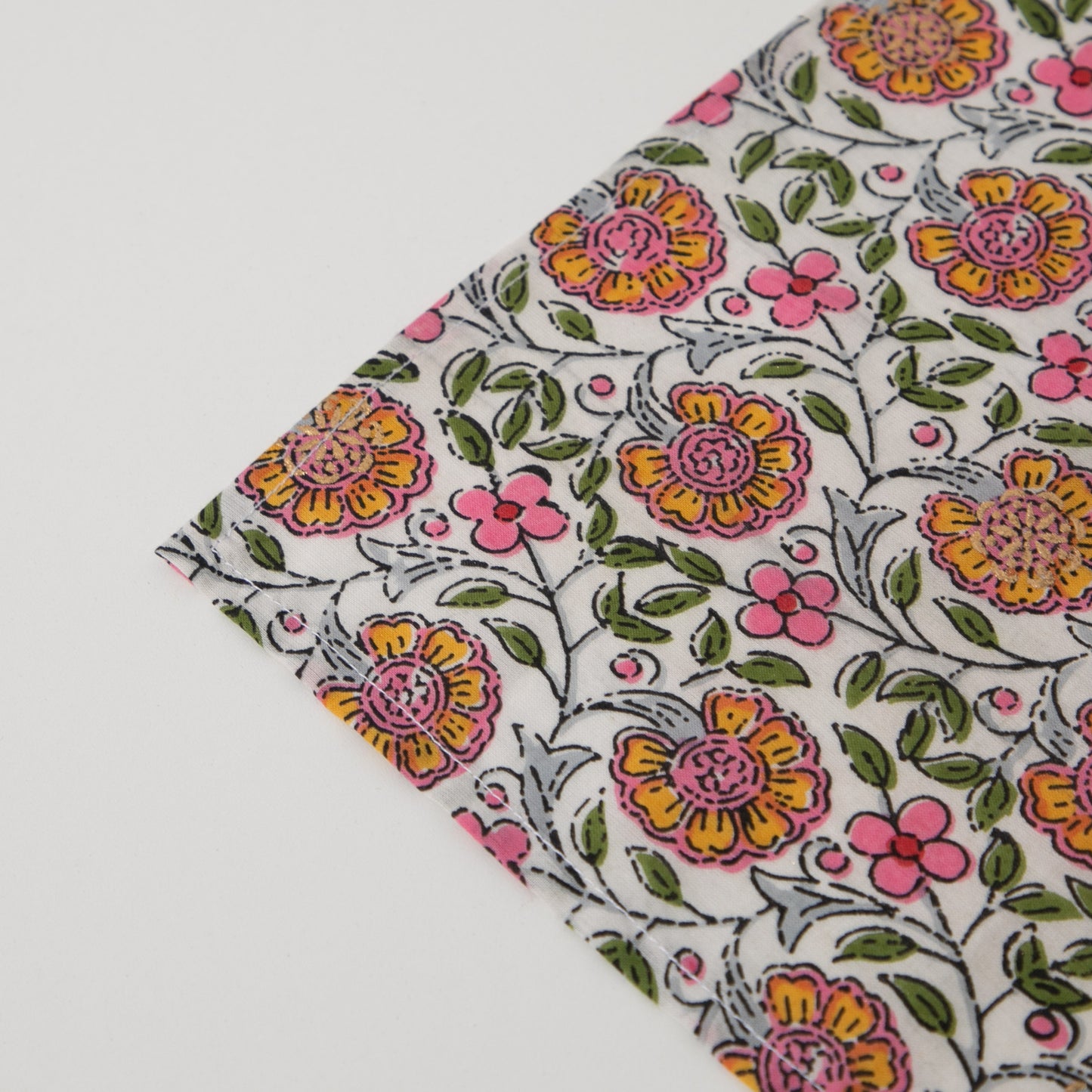 close up spring napkin mitred corner