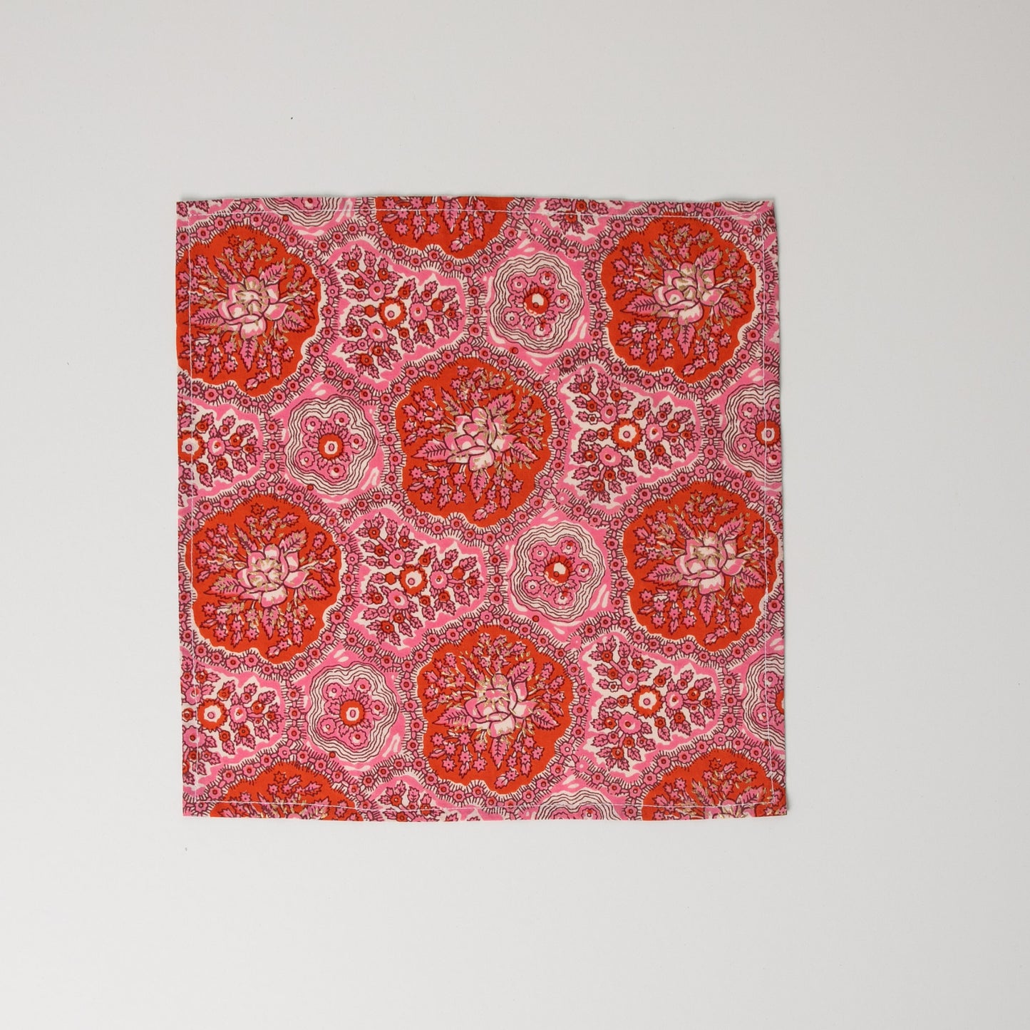 1 x pink cotton napkin sitting flat on white background