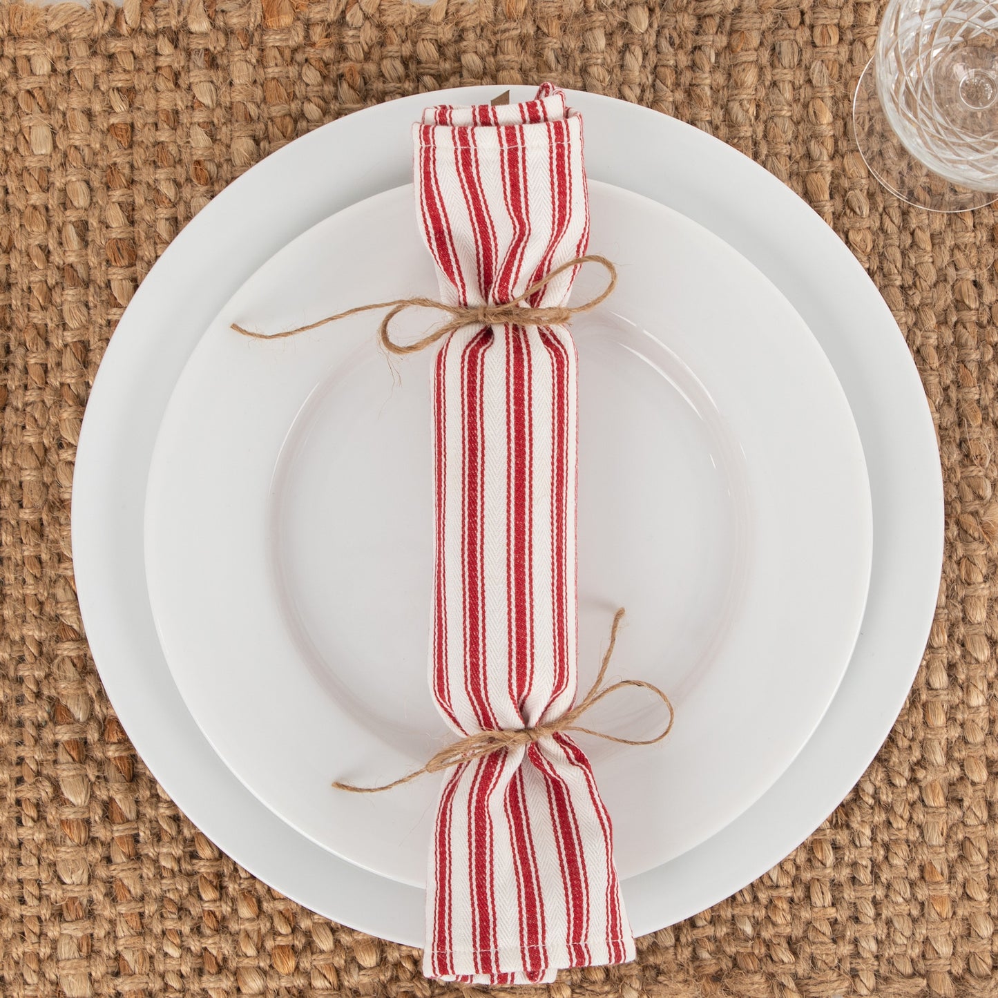 red ticking fabric bon bon sitting on white plate