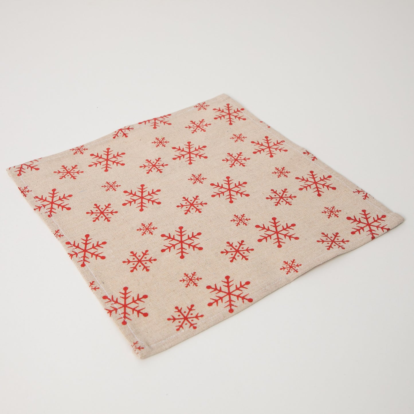 1 x square snowflake napkin sitting flat on white background