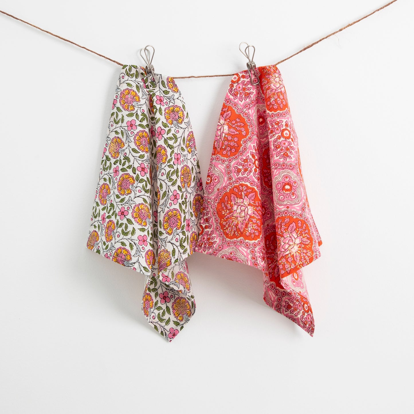 
                  
                    cotton napkins hanging on pegs
                  
                