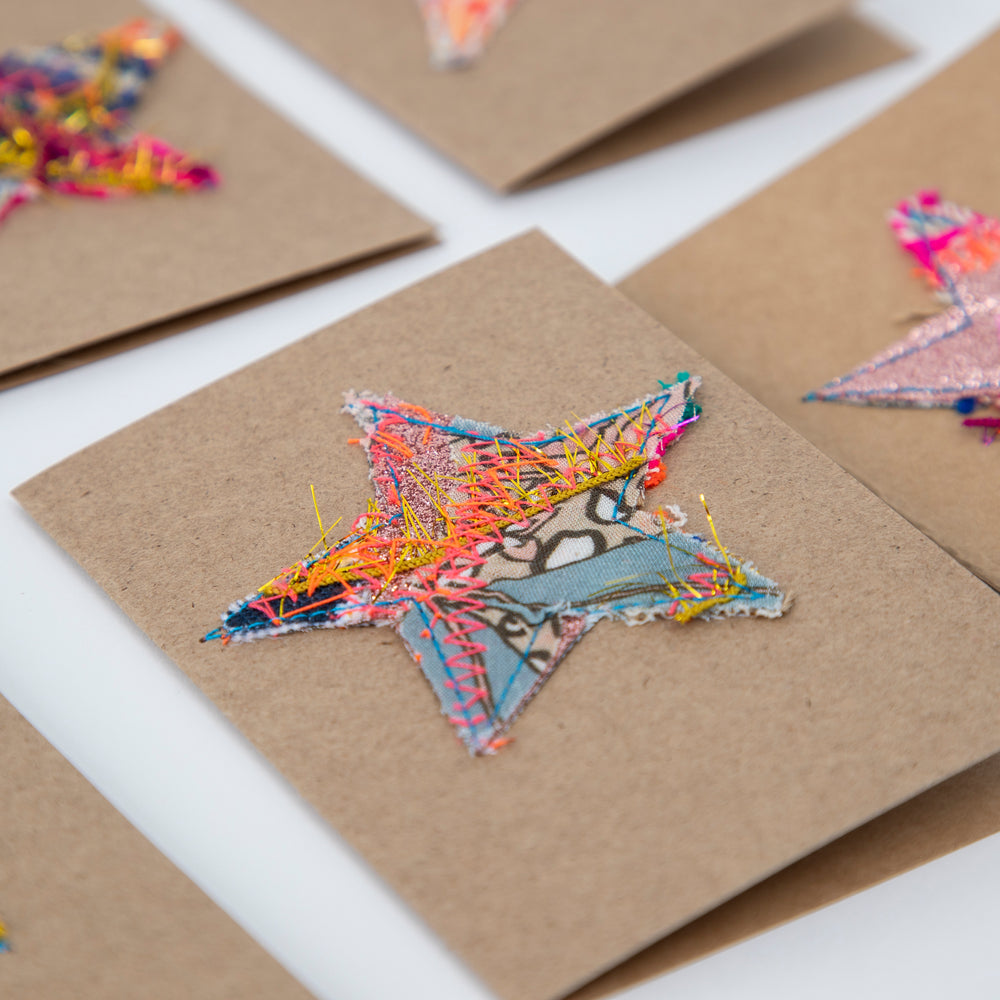 fabric stars sewn onto brown gift cards. no two the same!