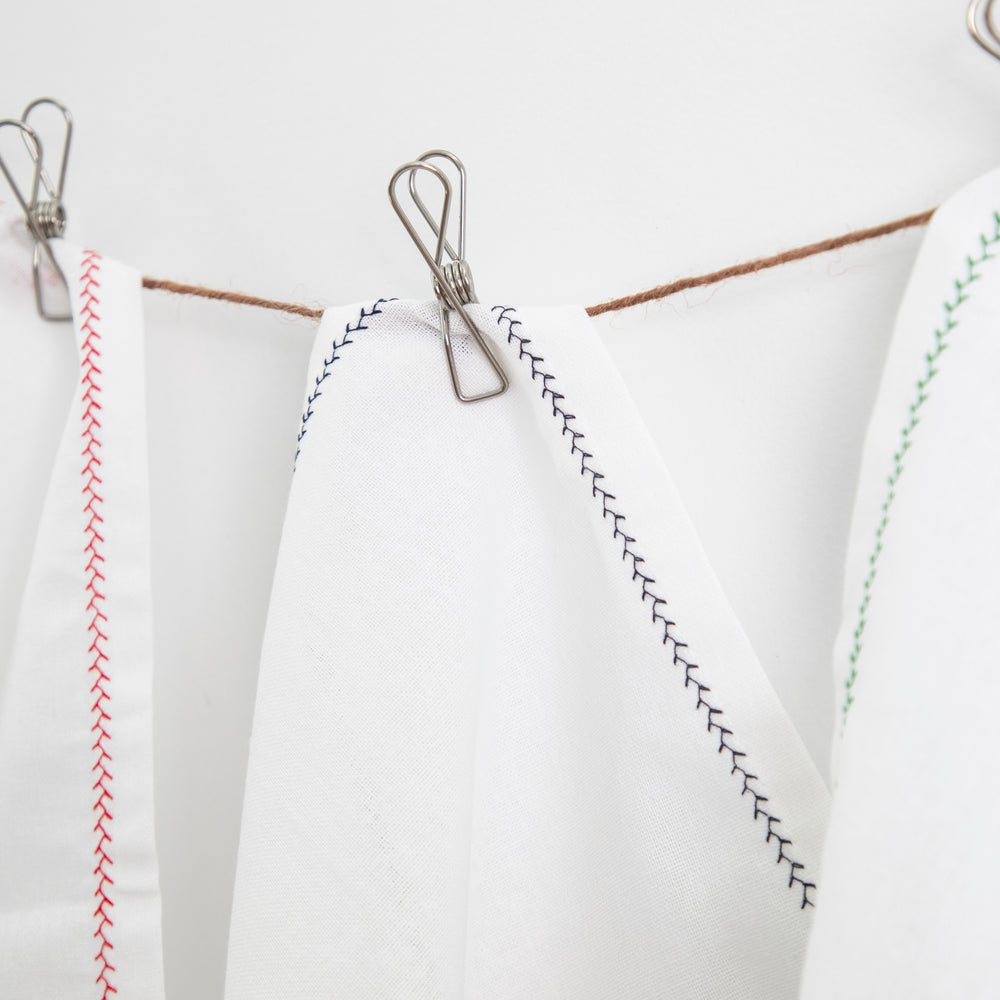 
                  
                    white cotton napkins with decorative trim
                  
                