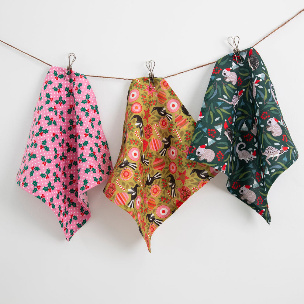 
                  
                    3 x styles of cotton Christmas Pocket Squares all hanging
                  
                