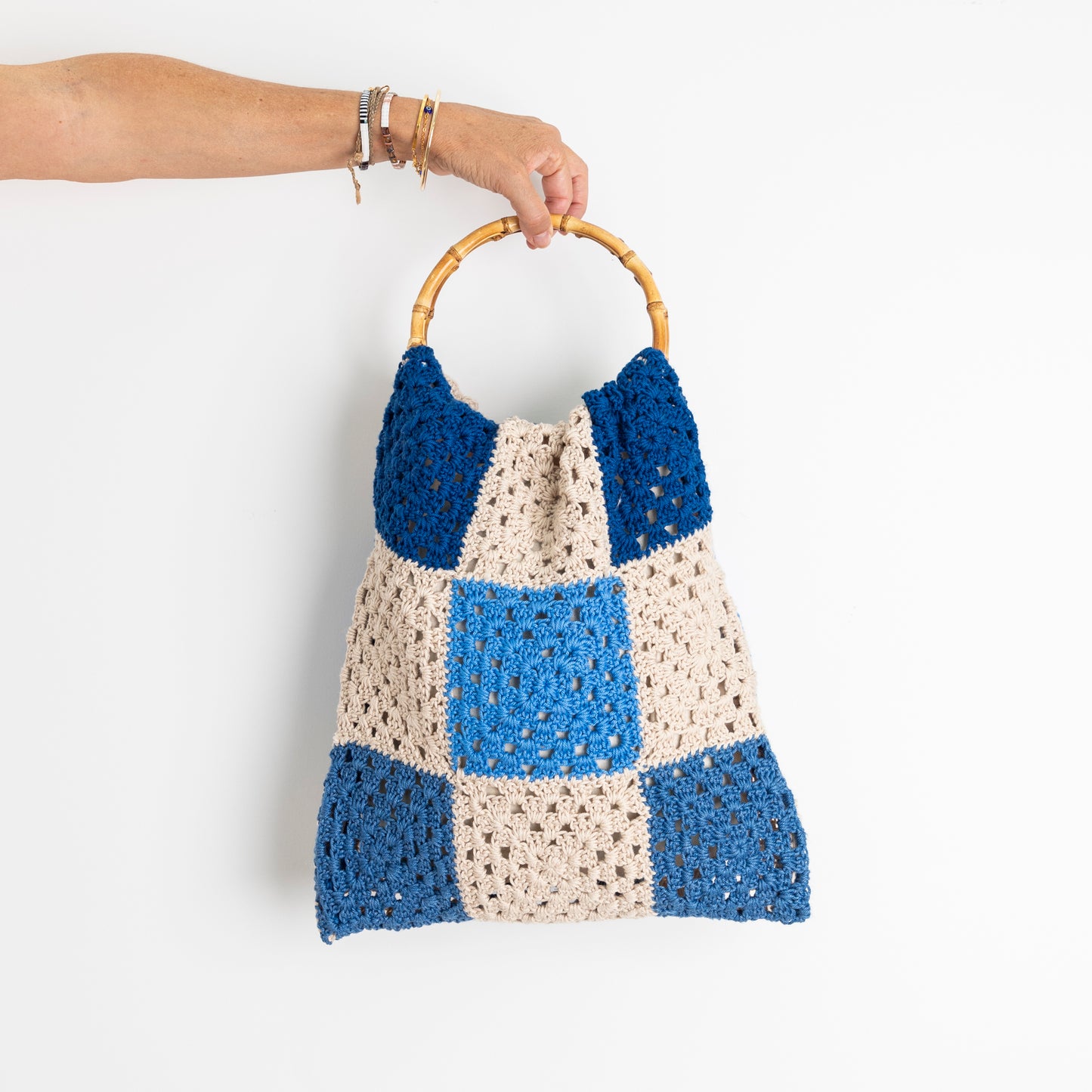 Repurposed, Crochet Blanket made into a bag with bamboo handles.