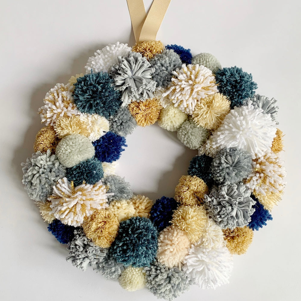 
                  
                    photo of a custom request for a Pom Pom Wreath with an Earthy Blue theme
                  
                