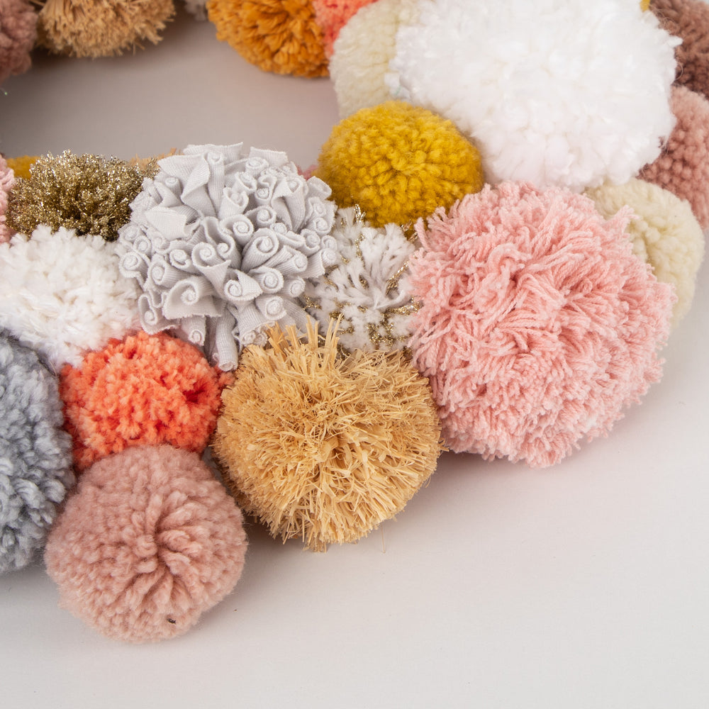
                  
                    Earthy Warm - close up of various pompom sizes and textures
                  
                