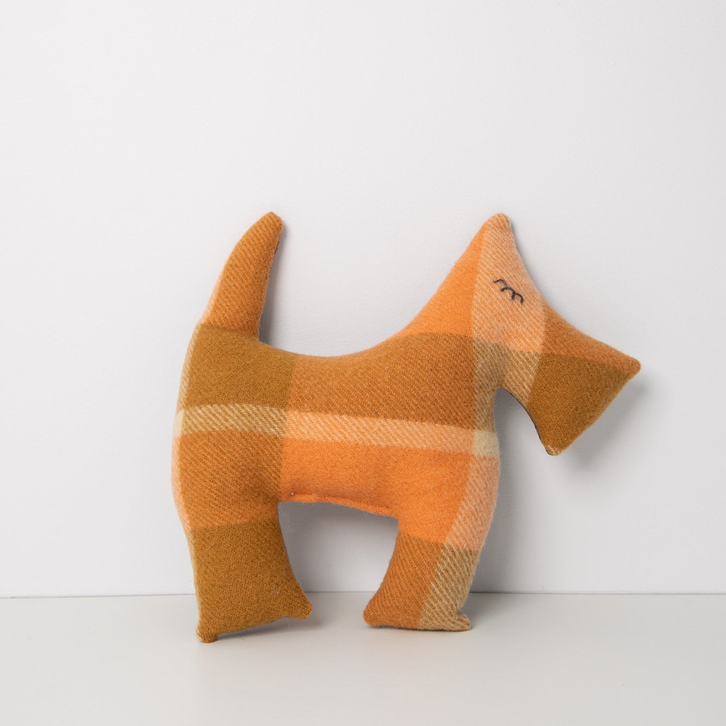 
                  
                    Peach Blanket up-cycled to make this Scotty Dog, standing on white background
                  
                